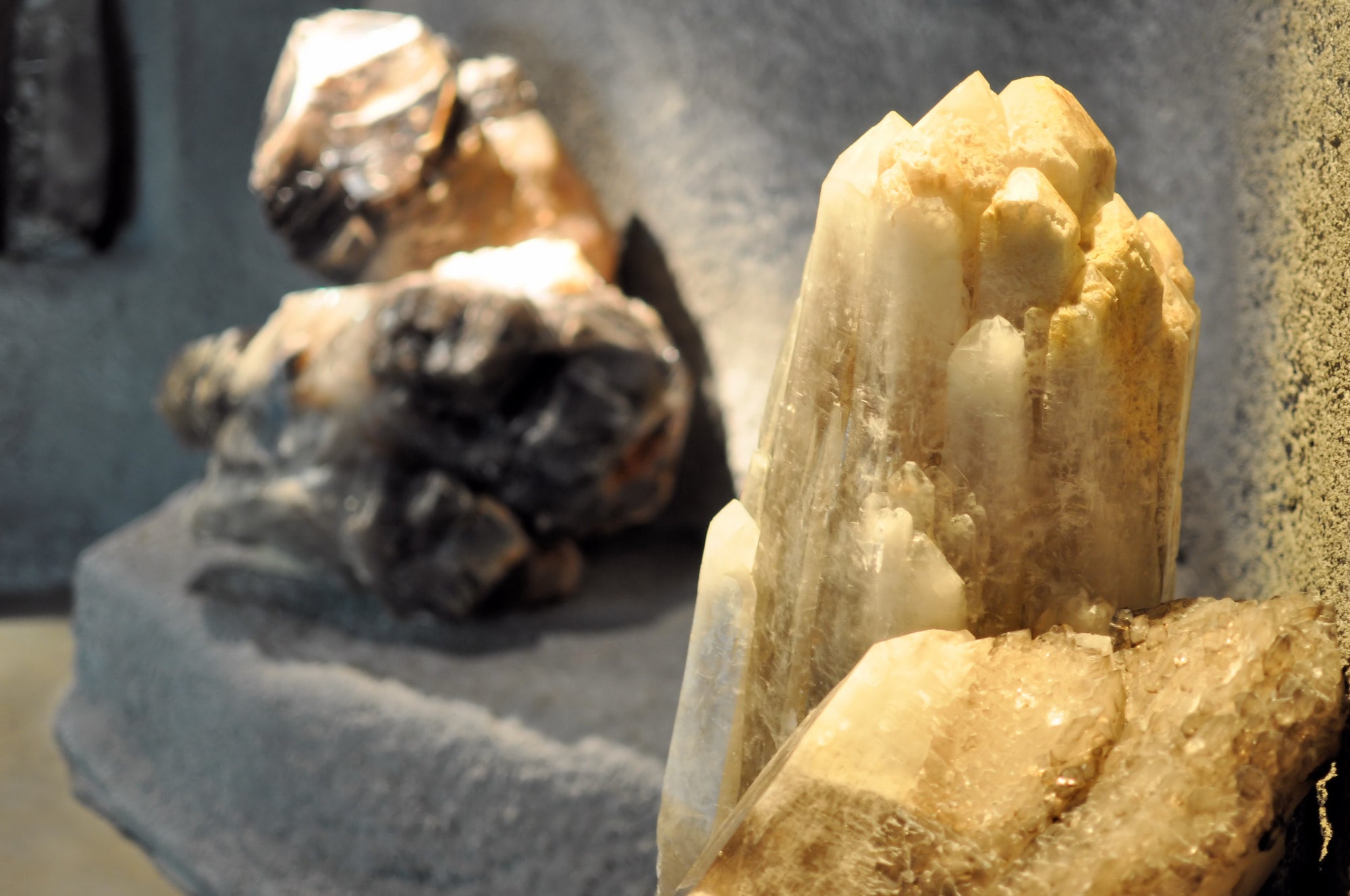 Close-up of crystal formations on a gray surface