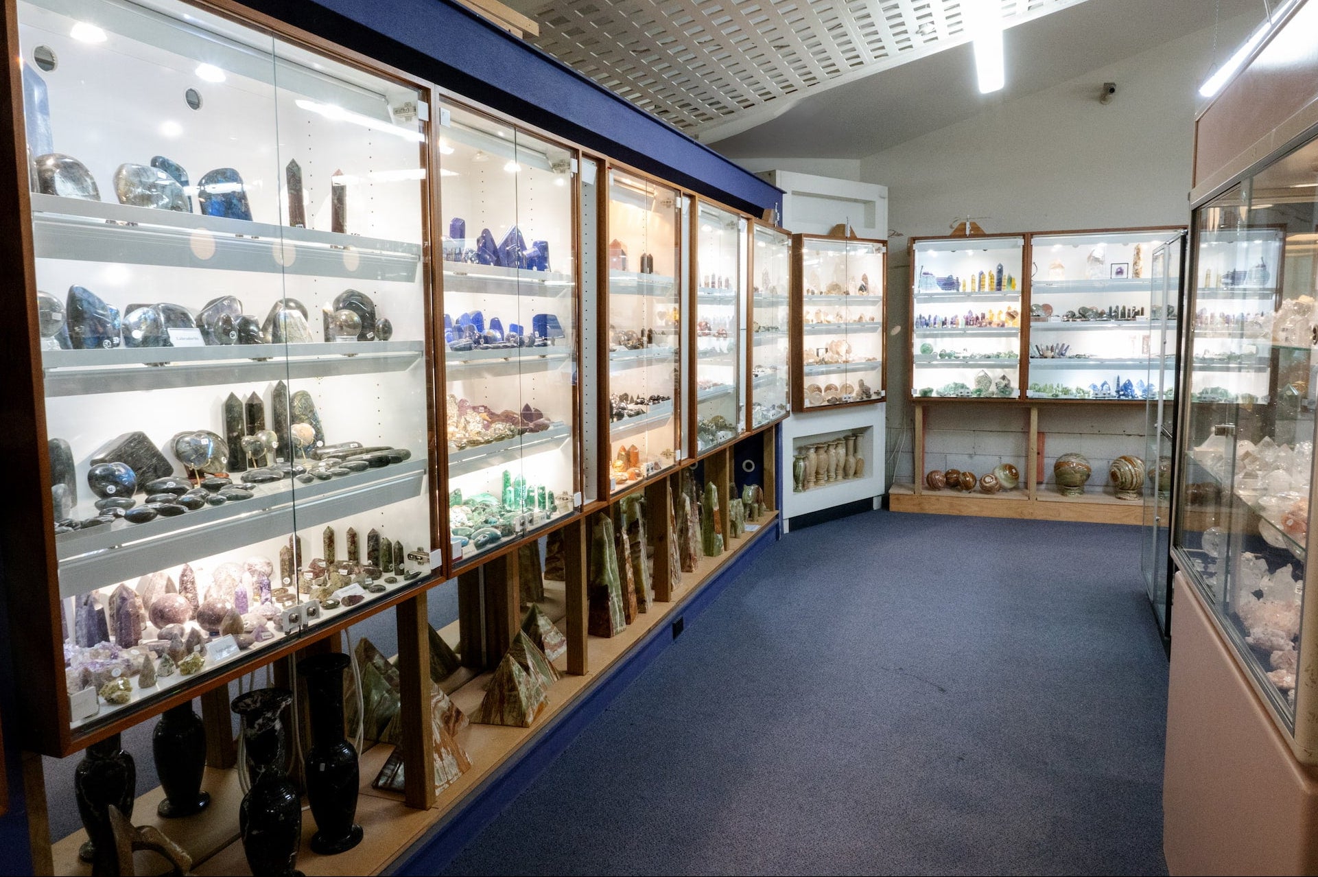 Display case with various crystals in a room setting